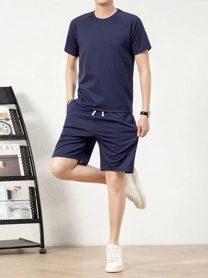Men's plus size navy short sleeve top and shorts set with drawstring pockets, slightly stretchy fabric.