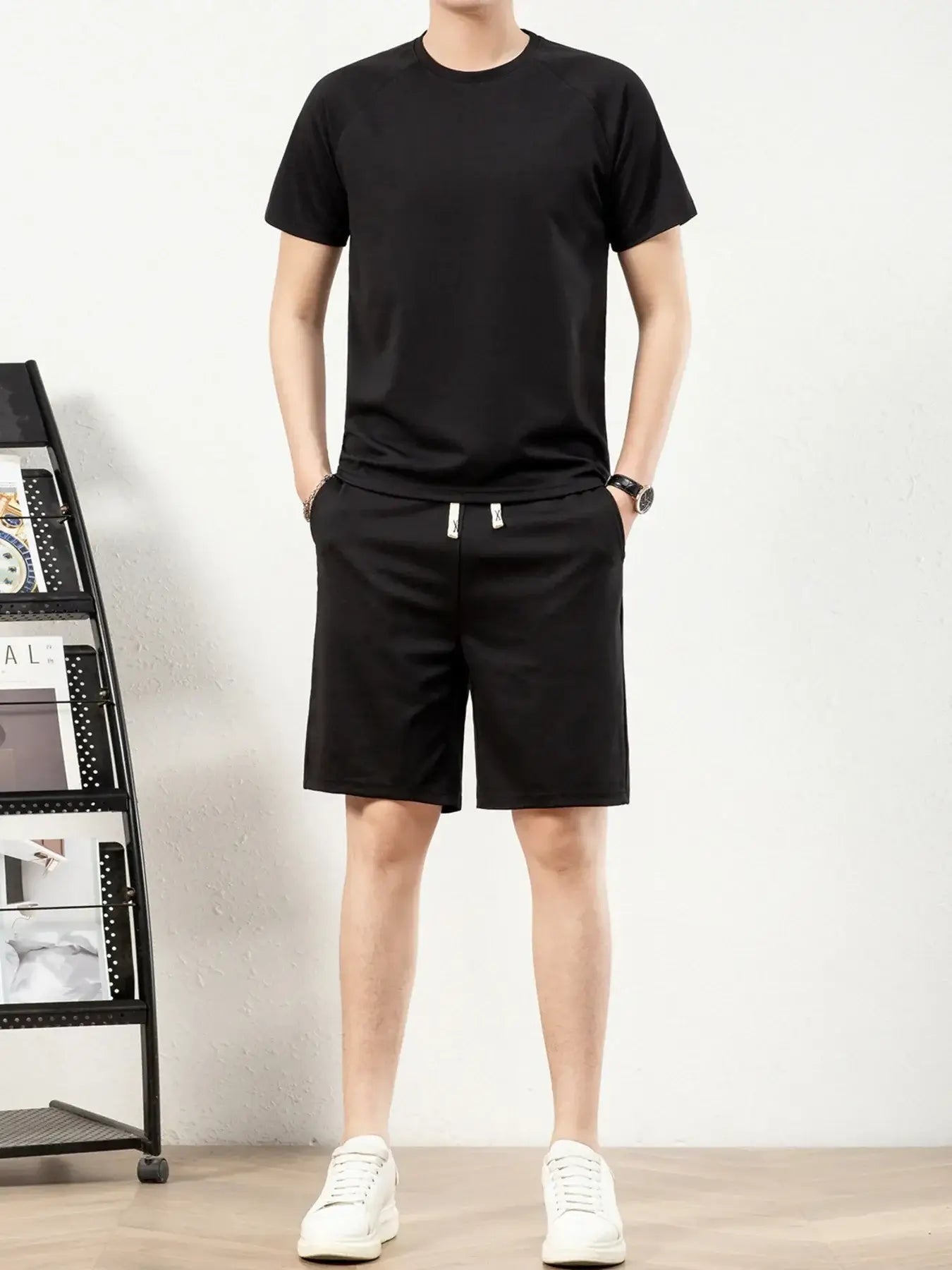 Men's plus size black short sleeve top and shorts set with drawstring pockets, perfect for casual wear.