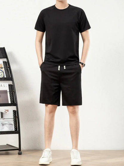Men's plus size black short sleeve top and shorts set with drawstring pockets, perfect for casual wear.