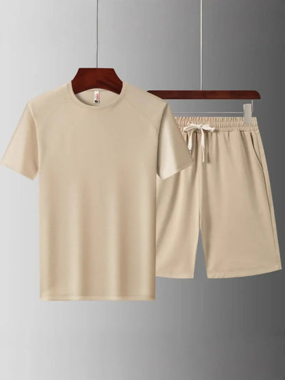 Men's plus size short sleeve top and shorts set in beige with drawstring and pockets, perfect for casual wear.