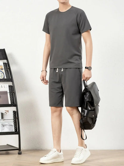Men's plus size short sleeve top and shorts set in dark gray, featuring drawstring shorts and a casual style.