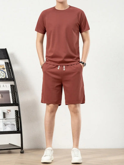 Men's plus size short sleeve top and shorts set in rust color, featuring drawstring and pockets.